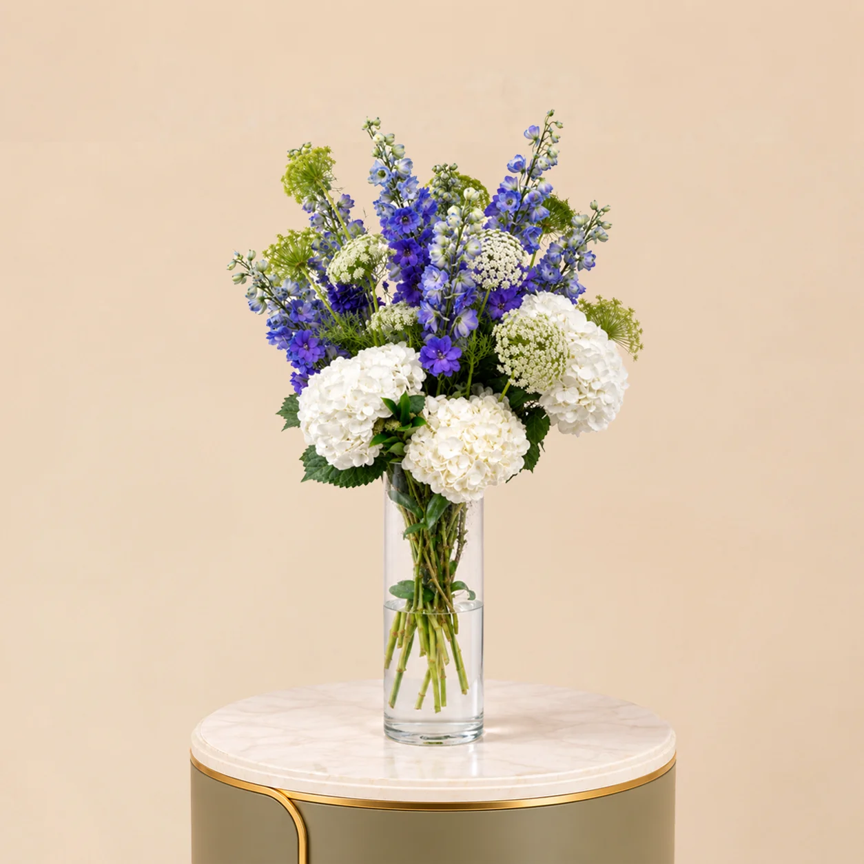 White Hydrangea & Blue Delphinium in Clear Glass Vase