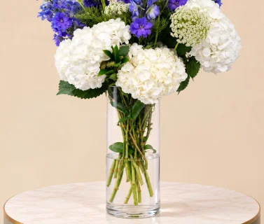 White Hydrangea & Blue Delphinium in Clear Glass Vase 2