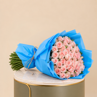 100 Light Pink Roses – Bright Blue Wrap – Flori Mart Doha 2